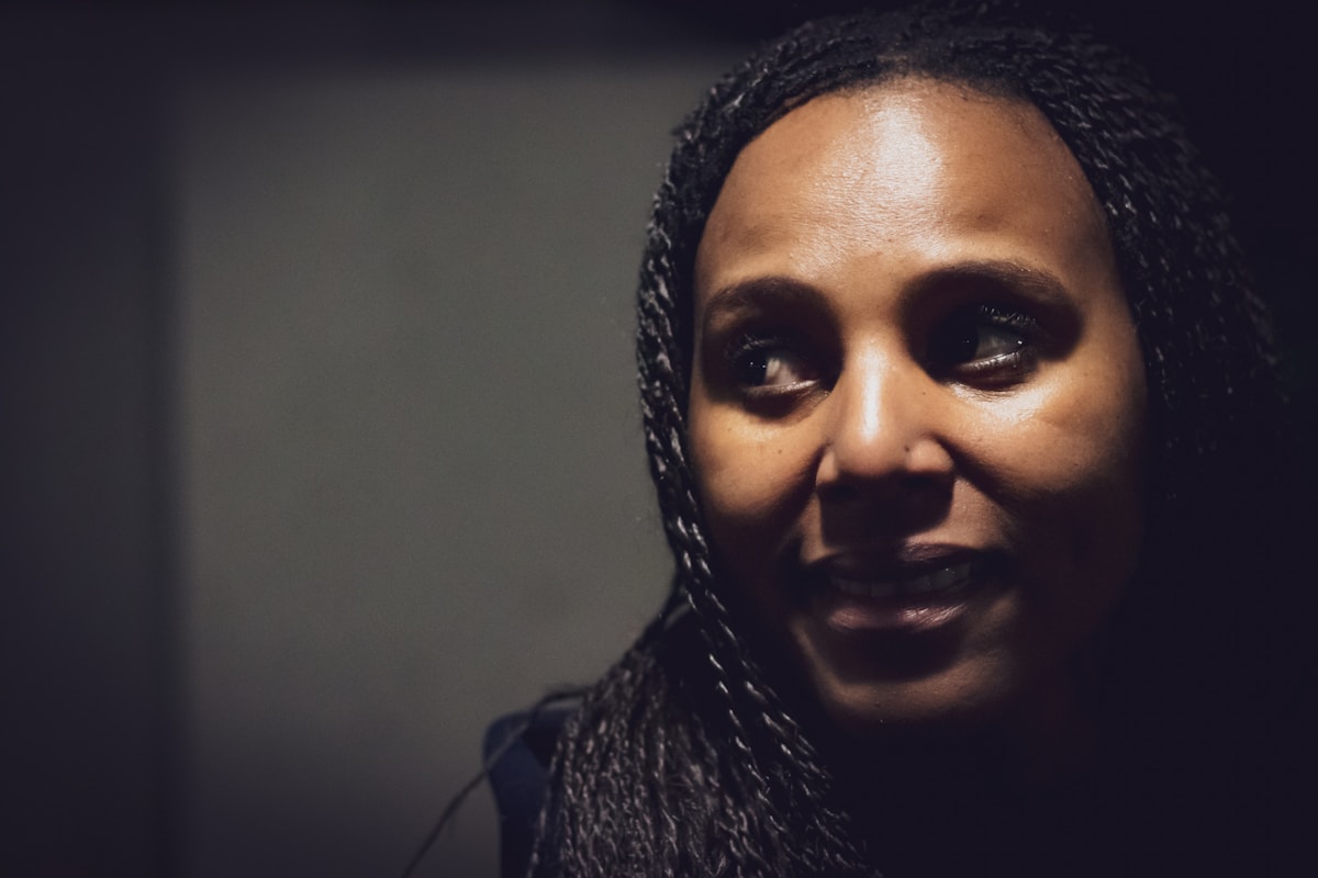Close portrait of a person in gallery light
